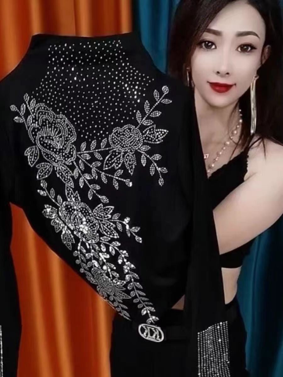 Stylish long-sleeve top featuring elaborate rhinestone embellishments—a trendy, high-fashion piece with a sophisticated design, perfect as a stylish base layer that exudes femininity.