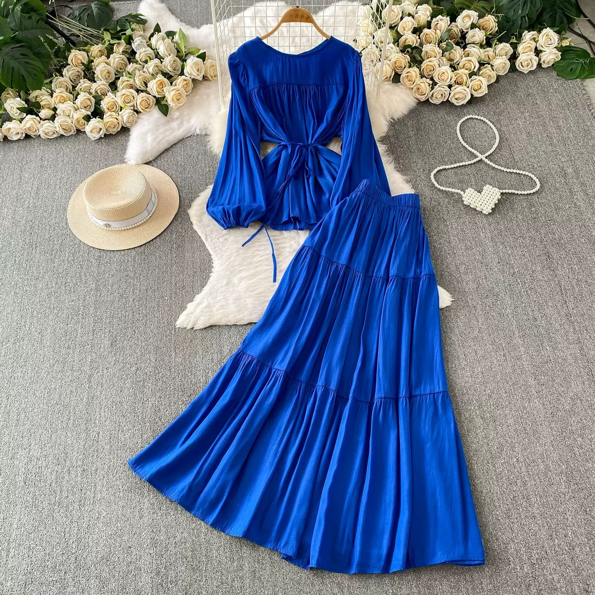 French-style chic casual two-piece set: a loose, round-neck pullover top with a waist-cinching tie detail (designed for a slimming effect) paired with a high-waisted long skirt—suitable for work or daily wear.👉 (30% advance) vibrant vogue