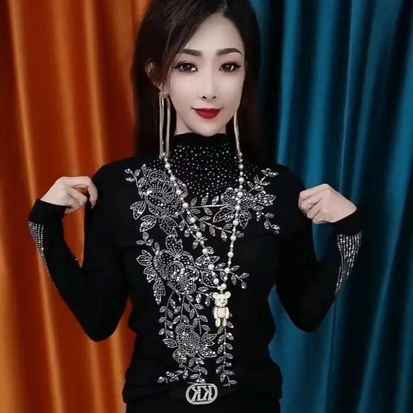 Stylish long-sleeve top featuring elaborate rhinestone embellishments—a trendy, high-fashion piece with a sophisticated design, perfect as a stylish base layer that exudes femininity.