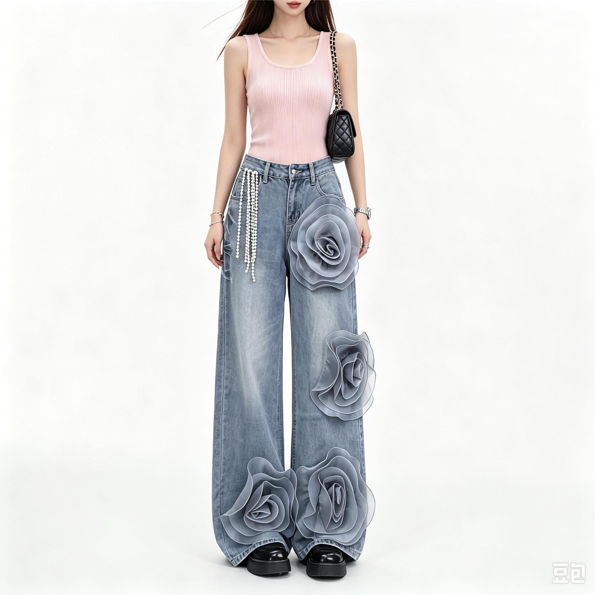 Exquisitely designed women's wide-leg jeans with 3D floral details and a heavy-duty pearl chain, featuring a high waist and flowing drape.