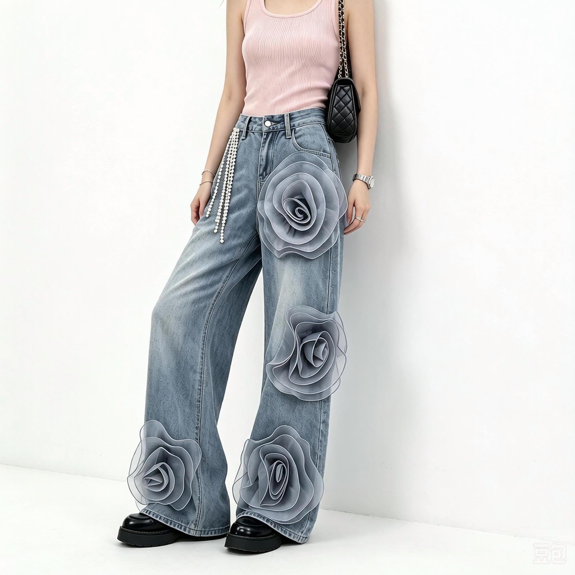 Exquisitely designed women's wide-leg jeans with 3D floral details and a heavy-duty pearl chain, featuring a high waist and flowing drape.